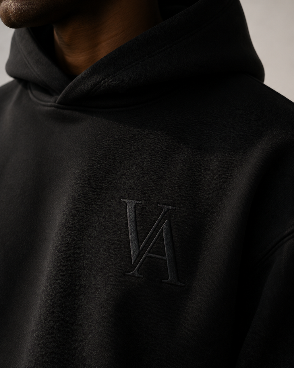 VAELO Foundation Hoodie in Black — chest embroidery detail