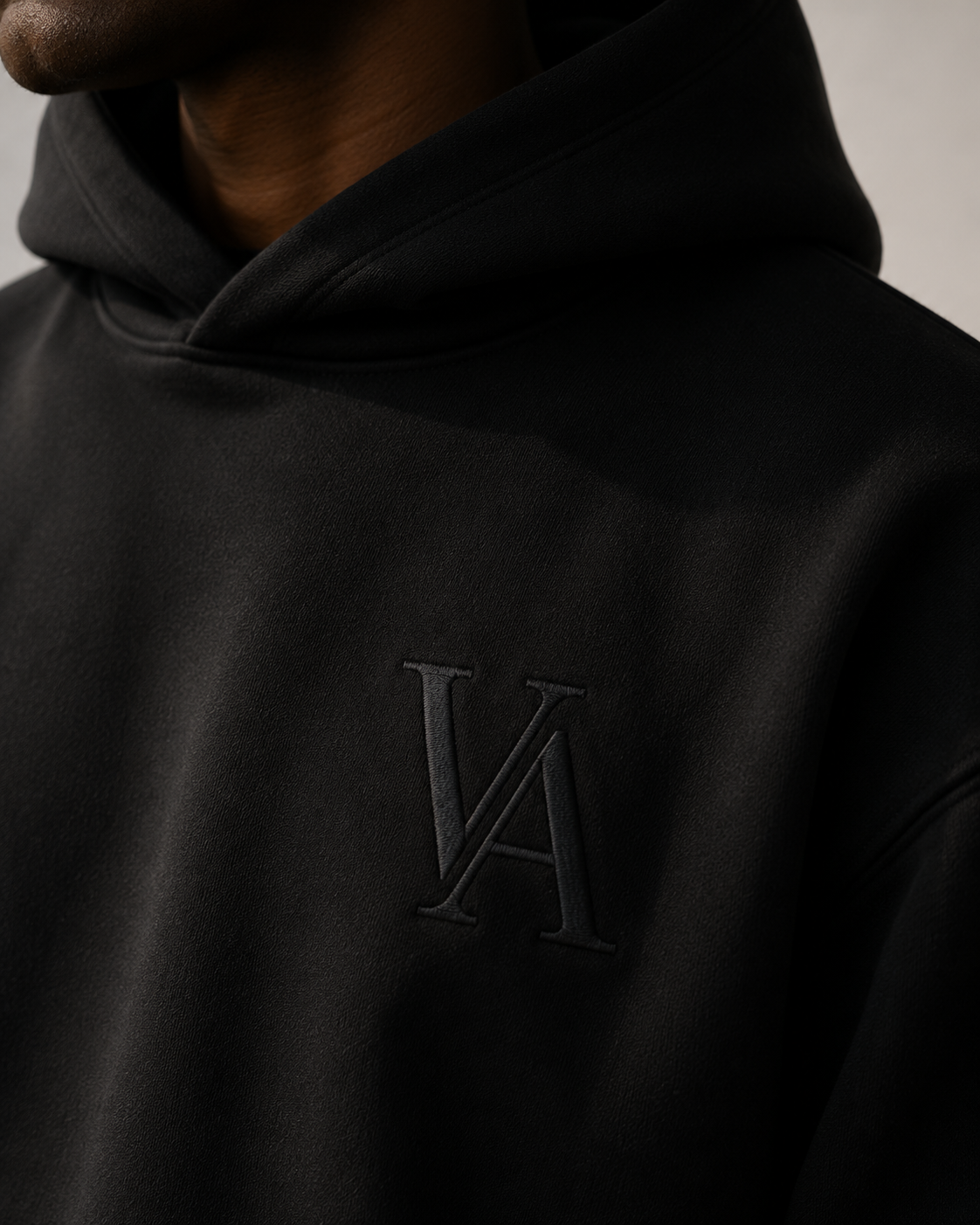 VAELO Foundation Hoodie in Black — chest embroidery detail