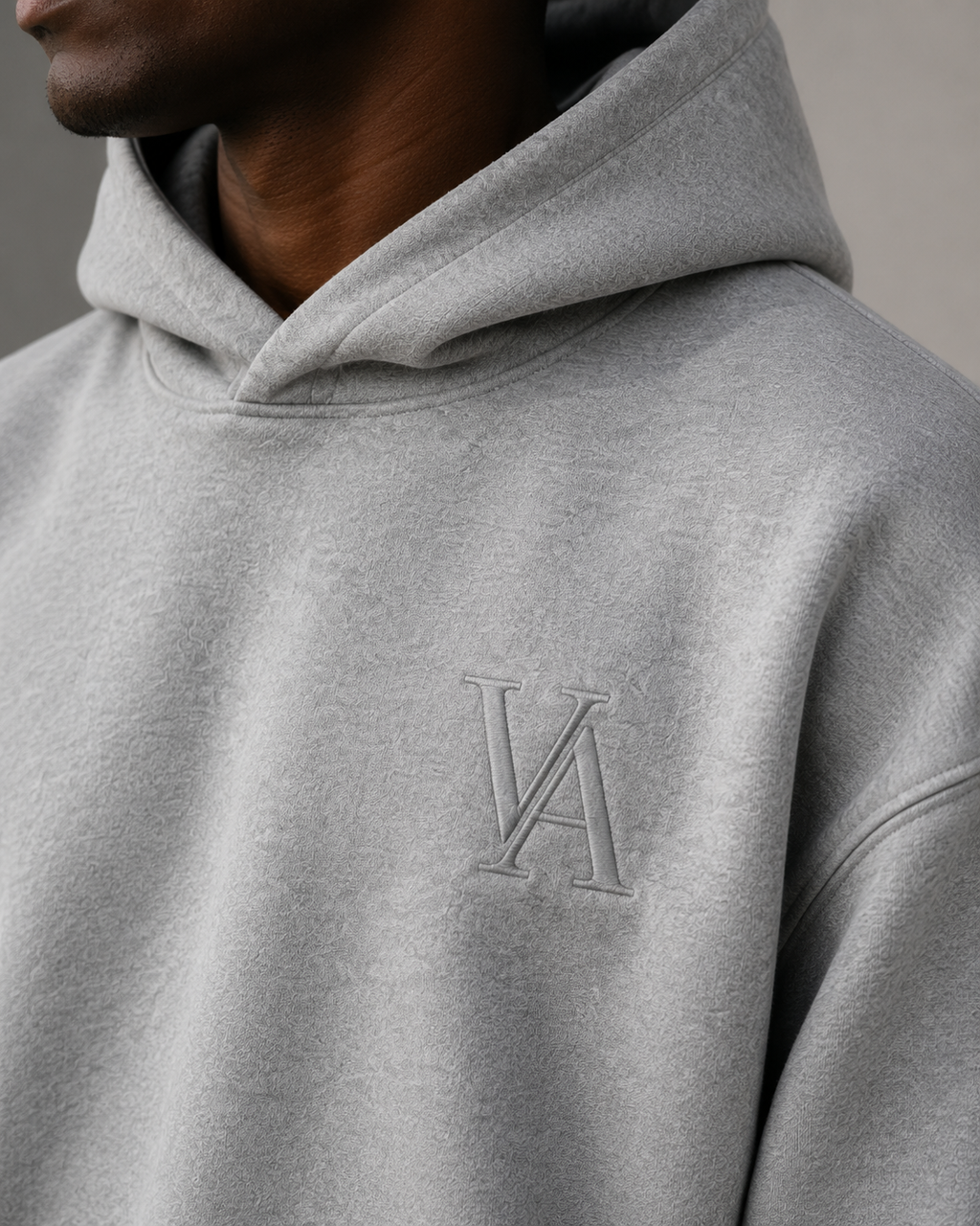 VAELO Foundation Hoodie in Heather Grey — chest embroidery and hood detail