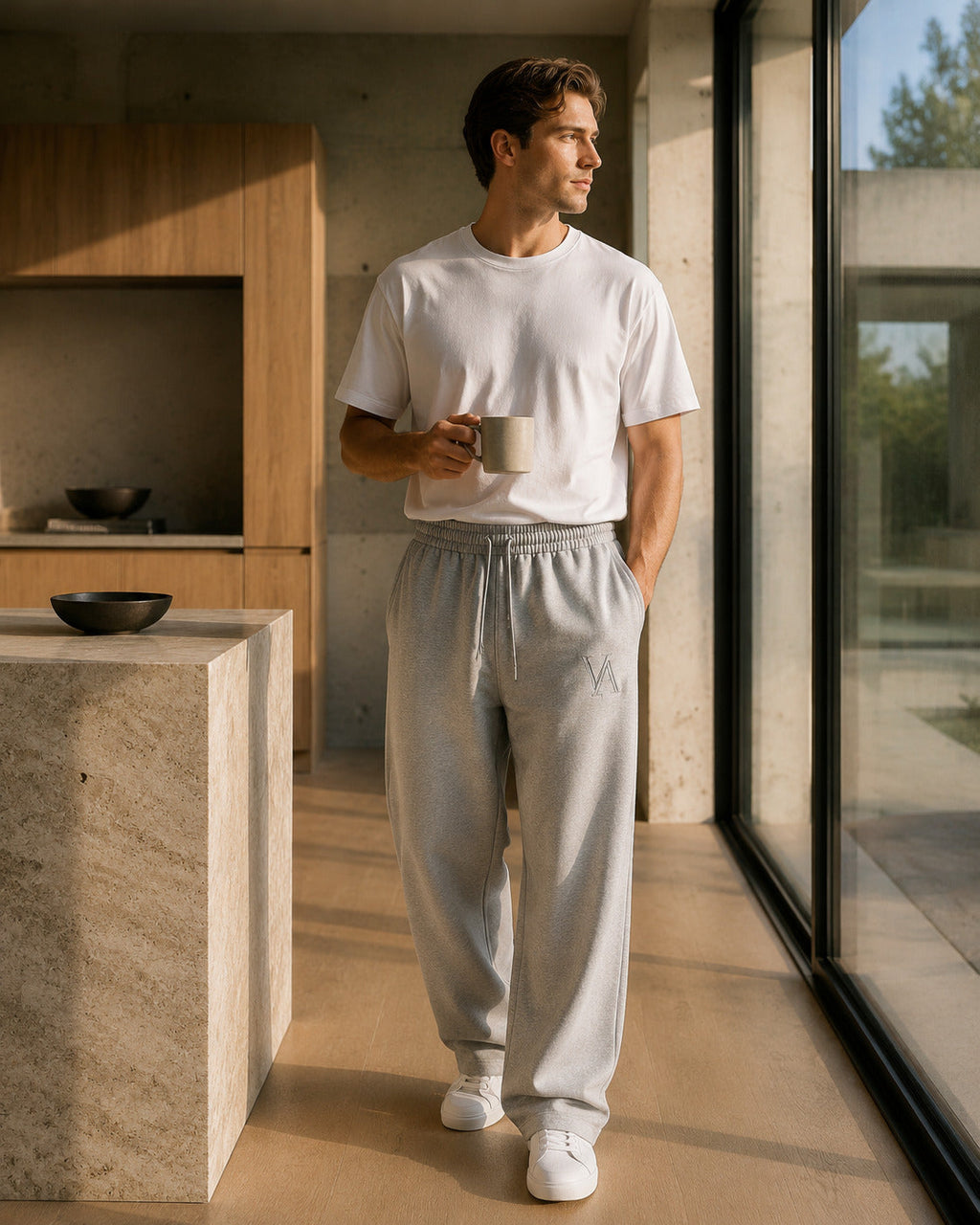 VAELO Foundation Sweatpant in Heather Grey — three-quarter on-model view