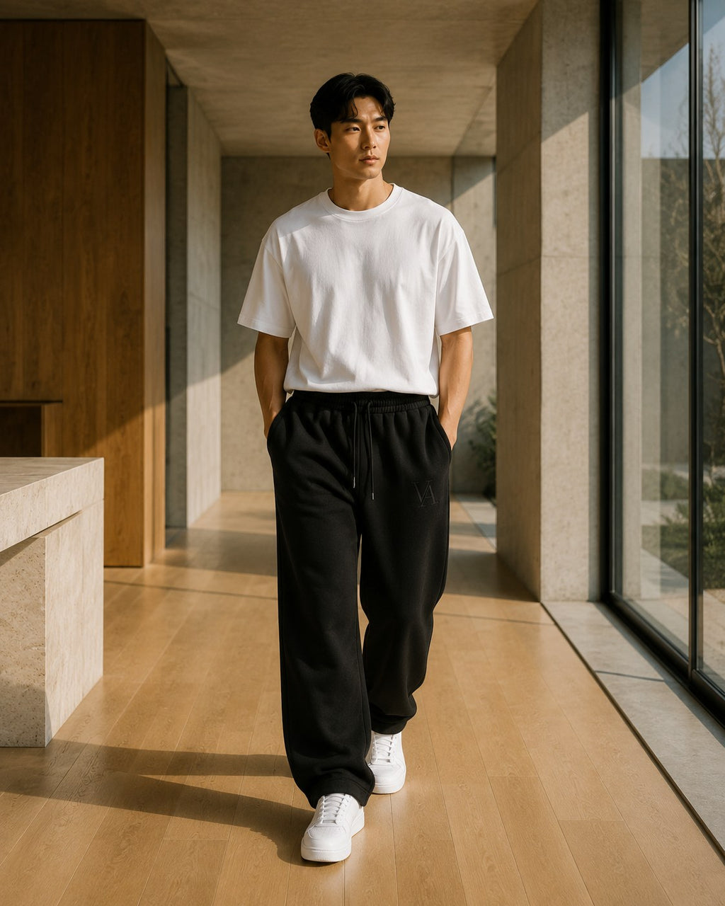 VAELO Foundation Sweatpant in Black — three-quarter on-model view