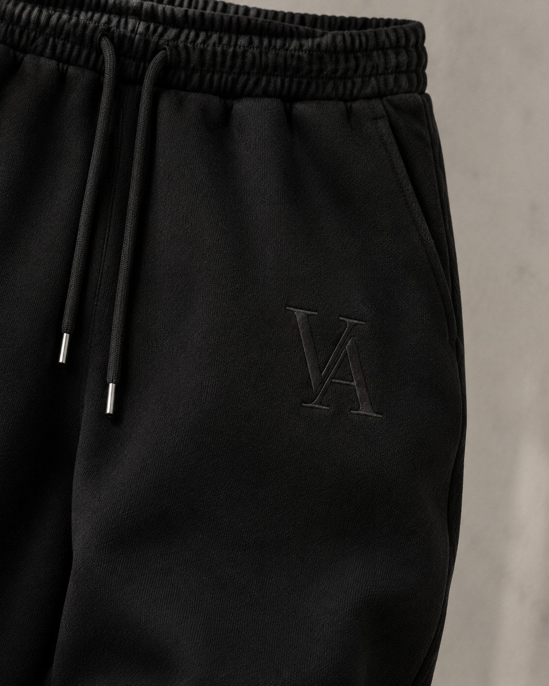 VAELO Foundation Sweatpant in Black — waistband, drawcord and VA embroidery detail